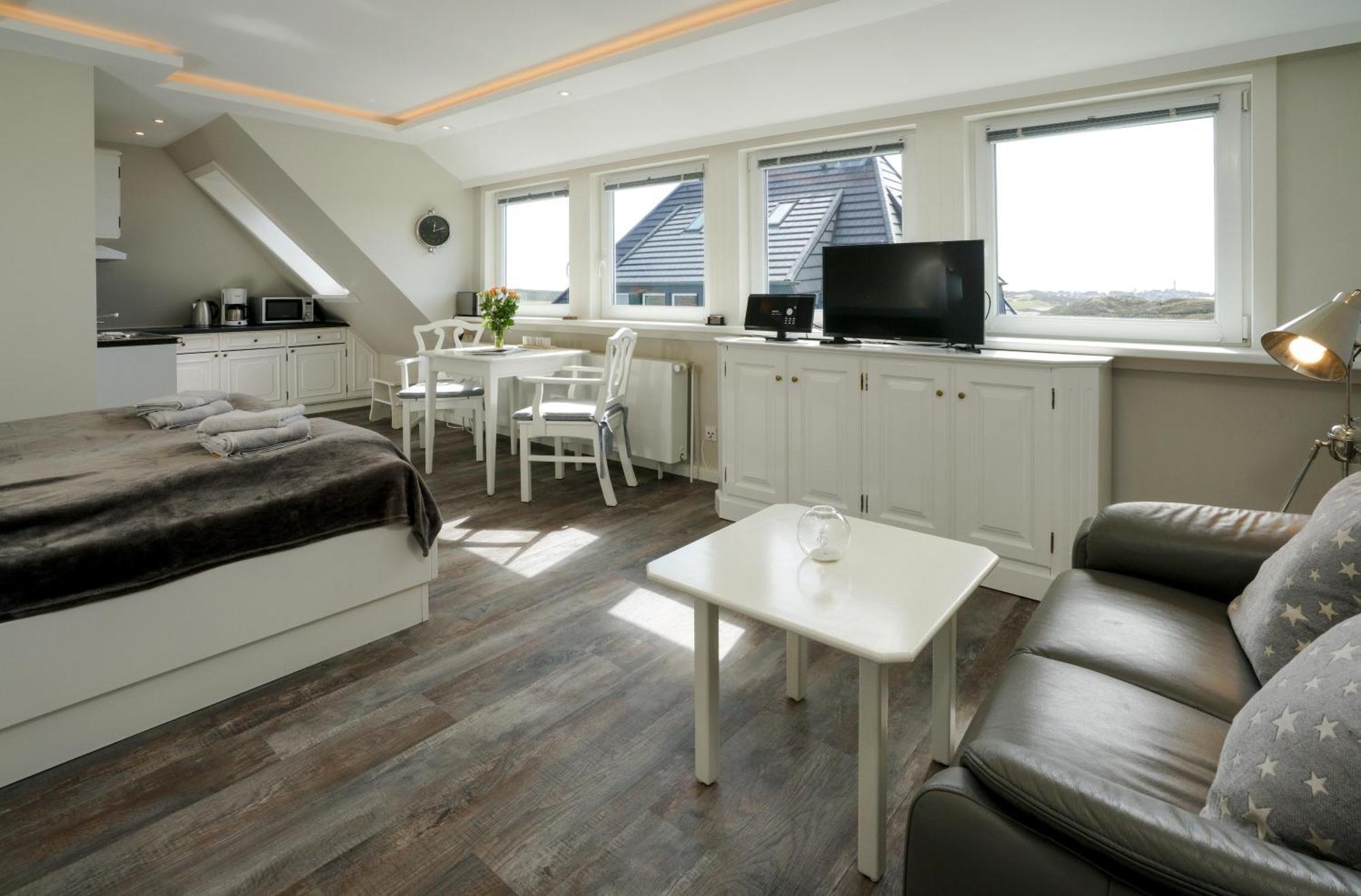 Gurtdeel Leuchtturm-Suite เฮอร์นุม ภายนอก รูปภาพ